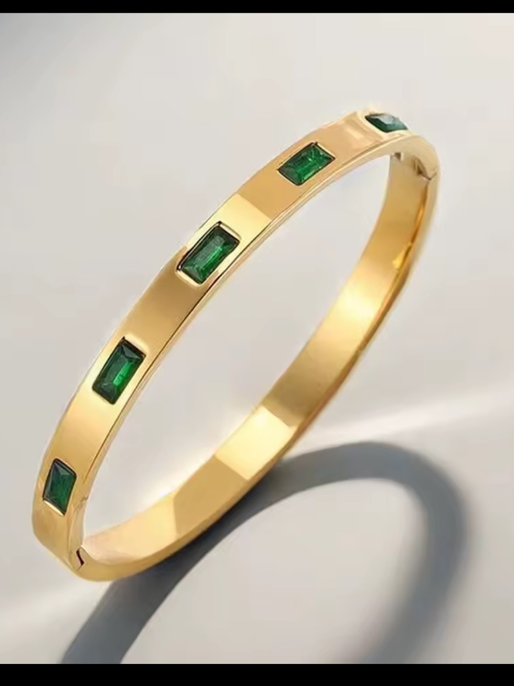 Gold Bangle with Emerald Green Accents